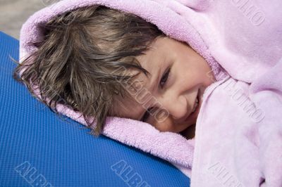 Boy in the towel after the pool