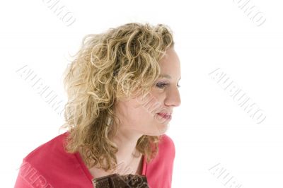 Young blond woman eats chocolate