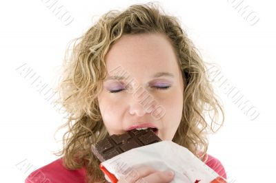 Young blond girl sneezing in the handkerchief