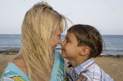 son and mom in the ocean beach