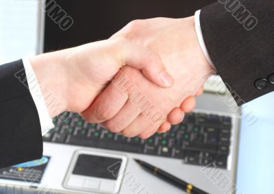 Hand shake of two people.