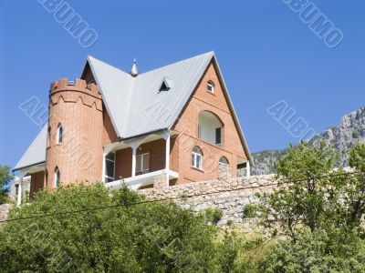 Stone cottage in mountains