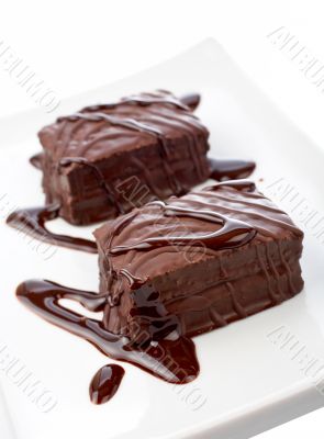 Two chocolate cupcakes on white plate