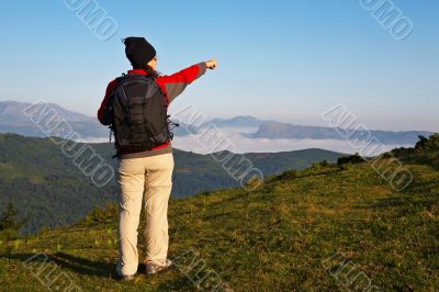 Girl with the backpack indicating