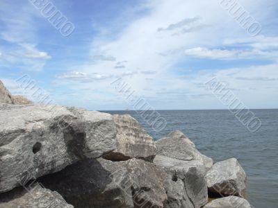 Large Rocks Jut Out to the Water