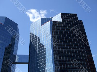 Two Mirrored Buildings Joined By Bridge