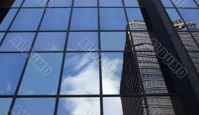 Clouds and Building Reflected Close Up