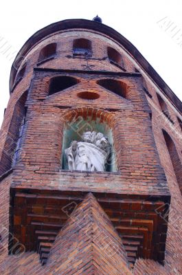Old church with saint staute