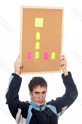 Holding the corkboard with notes