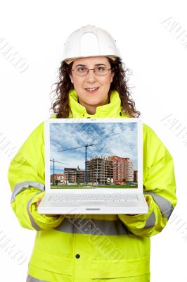 Showing a building construction on the laptop