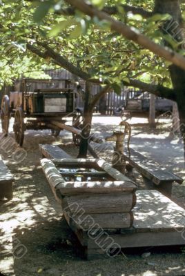 Wagon, pump and wooden trough