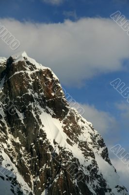 Jagged peak with hanging snowfields
