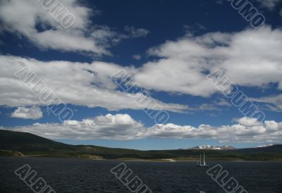 Sailboat in deceptively calm waters
