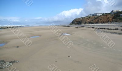 Flat beach with homes
