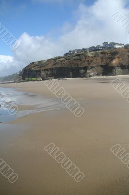 Flat beach with homes