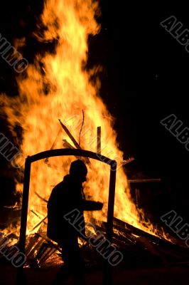 Framed silhouette front of fire