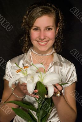 A smiling girl with lilies