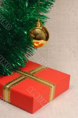 Gift box, ball and tinsel