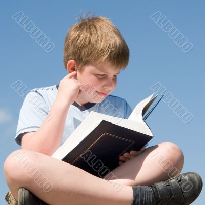 boy reads book