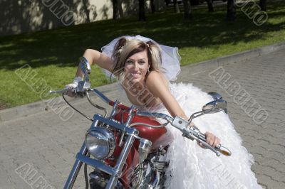 Bride and groom on a motorcycle