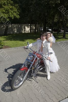Bride and groom on a motorcycle