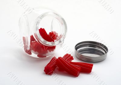 Pieces of red licorice on glass jar