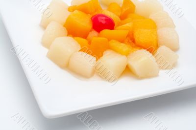 Fresh fruit salad on the white plate
