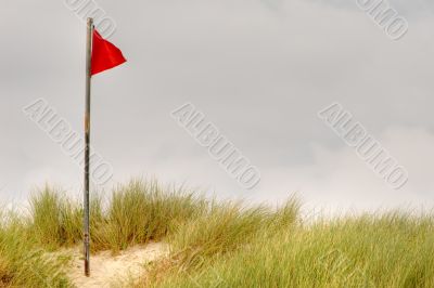red flag on beach