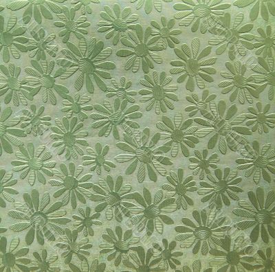 Green paper with camomiles