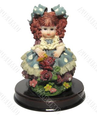 Statuette of young girl with bows