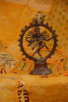 Bronze Shiva on yellow - orange