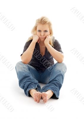 offended girl sitting on the floor