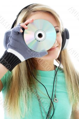 urban teenage girl in headphones holding cd