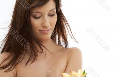 happy brunette with yellow lily flowers