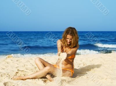woman playing with sand