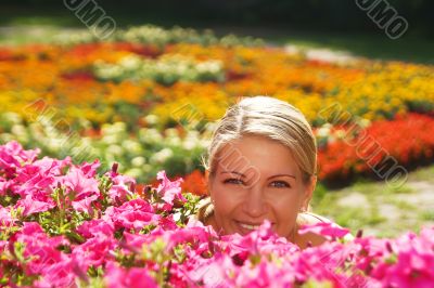 The woman is hidden behind flowers