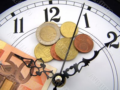 Watches and coins of euro.