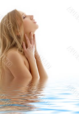 healthy blond with closed eyes in water