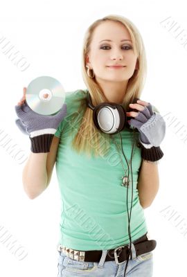 girl with headphones holding cd