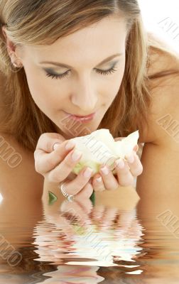 happy girl with white rose in water