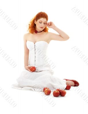 lovely redhead in red shoes with apples