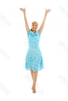 happy girl in blue dress with hands up