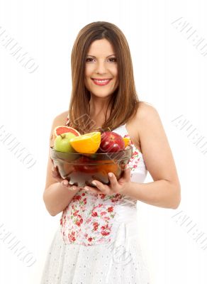 brunette girl holding cup of fruits