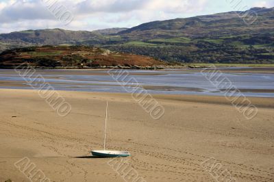 Stranded boat on sand