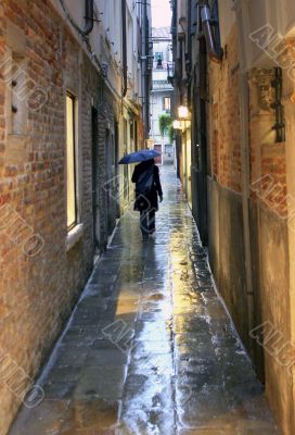Walking down alleyway in Venice