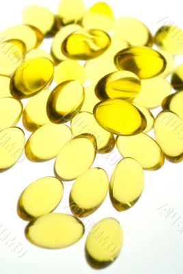 Close up of yellow gel capsules.
