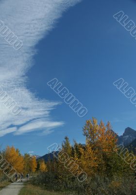 Hikers in park; storm front