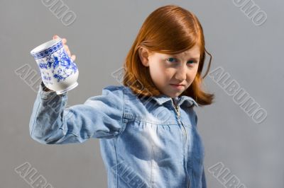 Girl with a cup (Focus on cup)