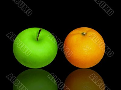 apple and orange on black glass