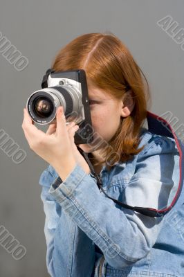 Girl with SLR photo camera